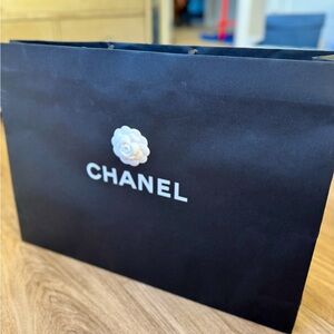 CHANEL Black Bag with White Logo and Flower